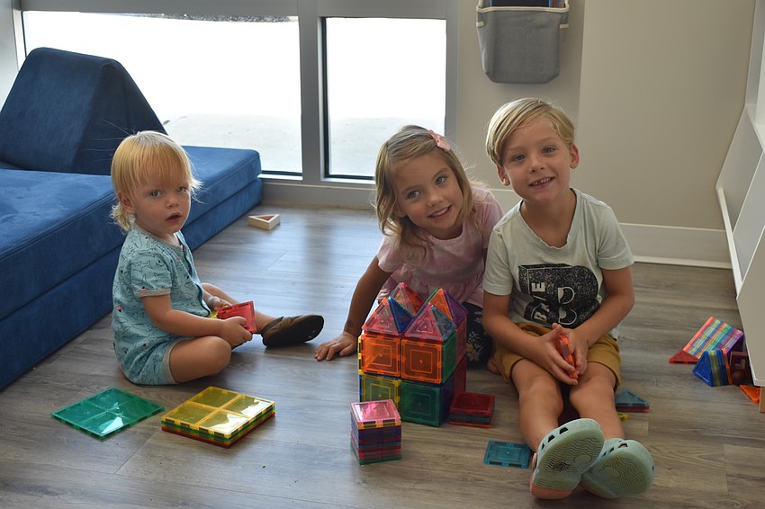 Avery Hallam, 18 months, from Myakka City, and 4-year-olds Jase Smoot and Ella Smoot, enjoy Pinnacle's play area.
