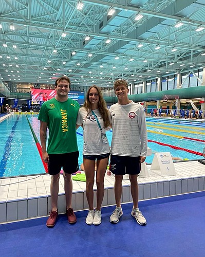 ODA rising senior Felipe Baffico Balharry (right) poses with Jamaican swimmer Keanan Dols and U.S. swimmer Emma Weyant. Dols and Weyant went to Sarasota&#39;s Riverview High. All three swam with the Sarasota Sharks. (Courtesy photo)