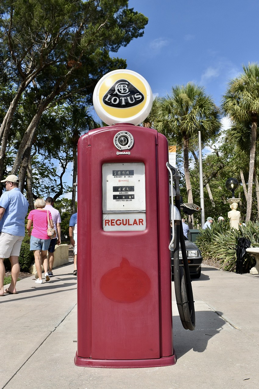 An old gas tank welcomes visitors to the car show.