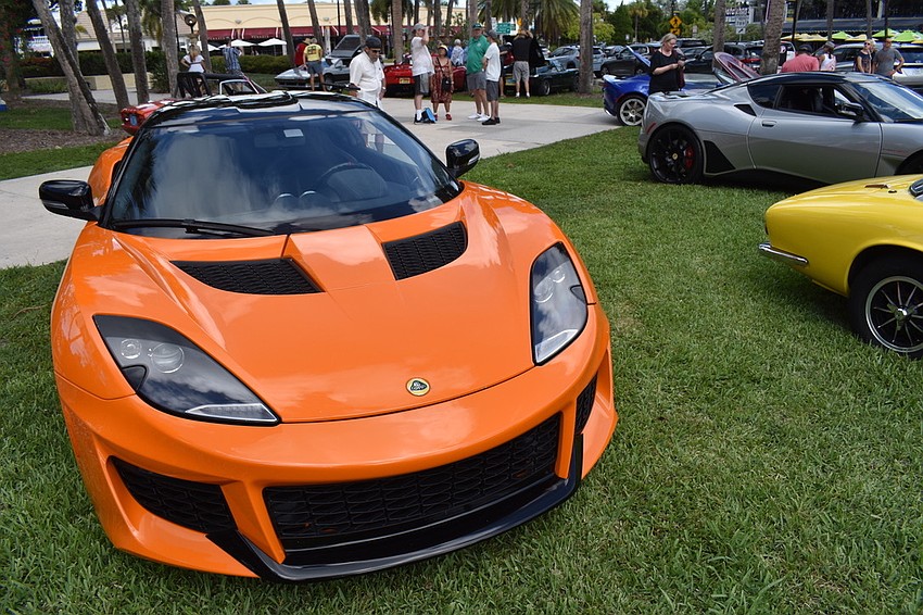 The Lotus cars causing mid-summer foot traffic in St. Armands Circle Park.
