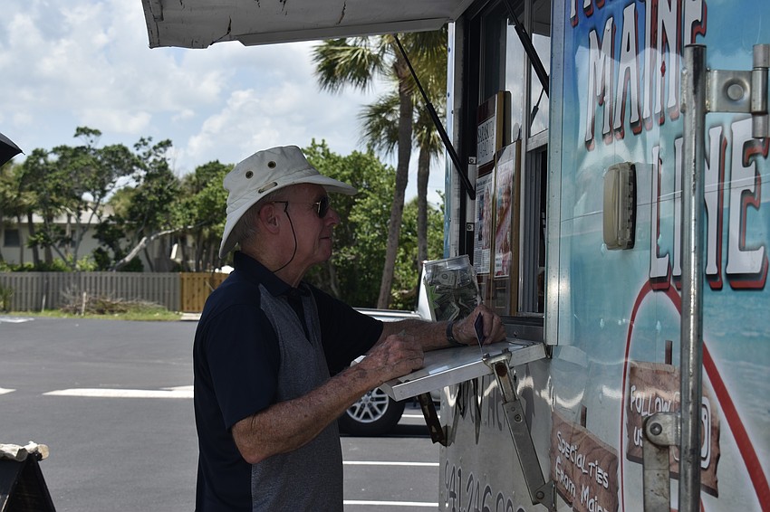 Bus Fischer orders lunch from the Maine Line food truck at Whitney Plaza.