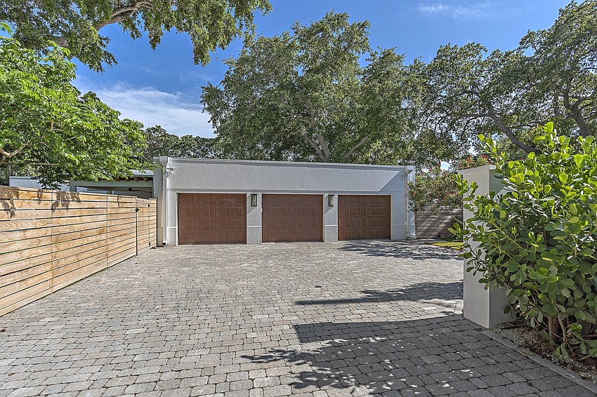 The garage is detached but connected to the rest of the home via covered walk.