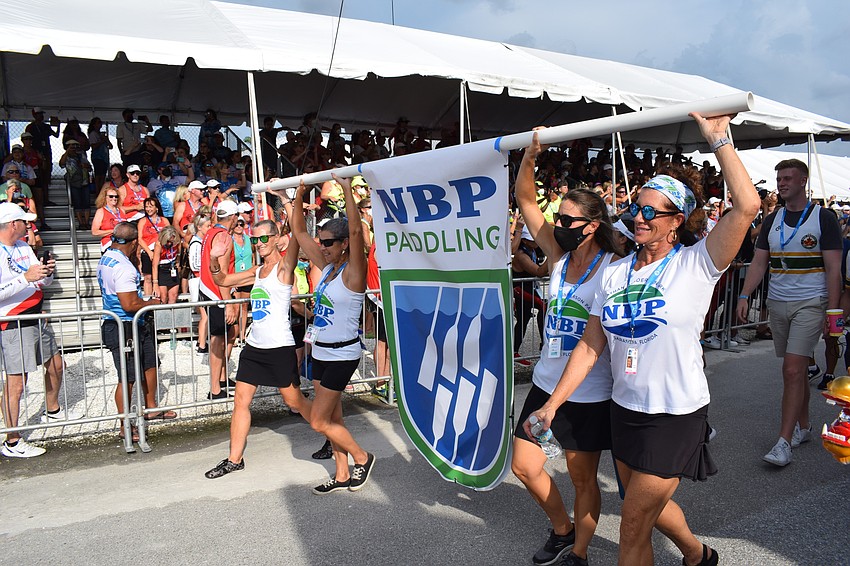 Nathan Benderson Park dragon boat team members participate in the opening ceremonies.