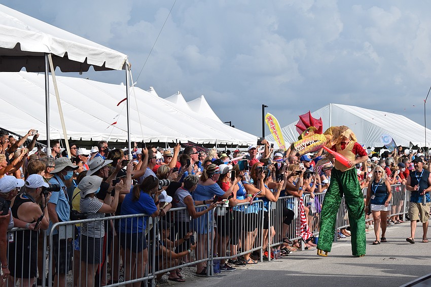 The dragon leads the beginning of the parade of athletes.