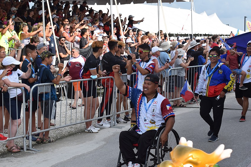 The team from the Philippines makes its entrance during the parade of athletes.