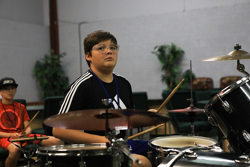 Marcelo Pizarro takes in the drum lessons. (Photos by Harry Sayer)