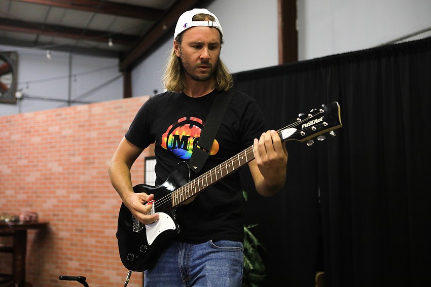 Music Compound instructor Taylor Galford leads with the guitar.