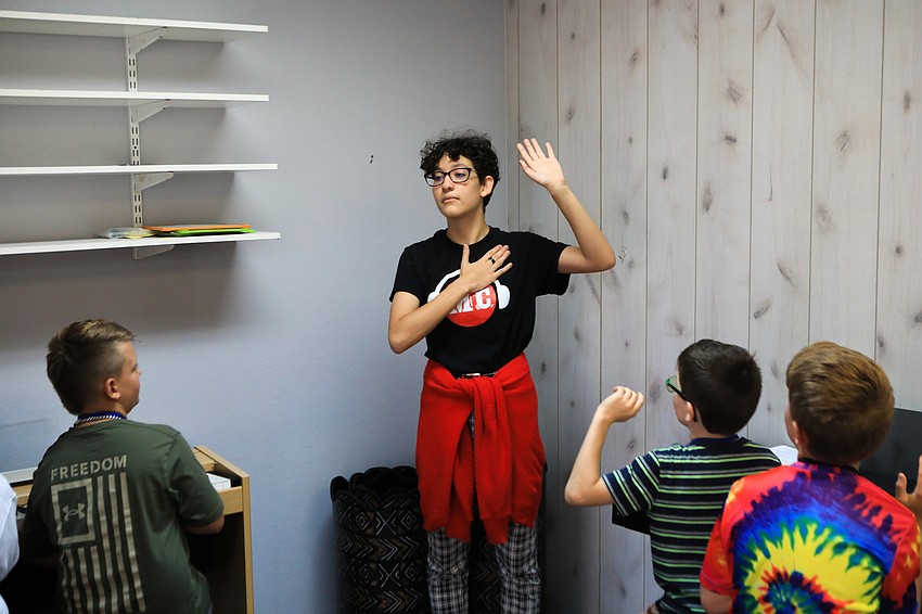 Instructor Sophia Derias has the children promise to be quiet while listening to instructions.