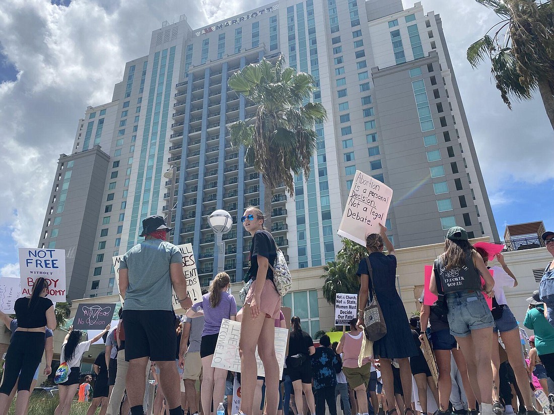 Protesters gathered outside a Moms for Liberty event in Tampa. Photo by Ryan Dailey, News Service of Florida