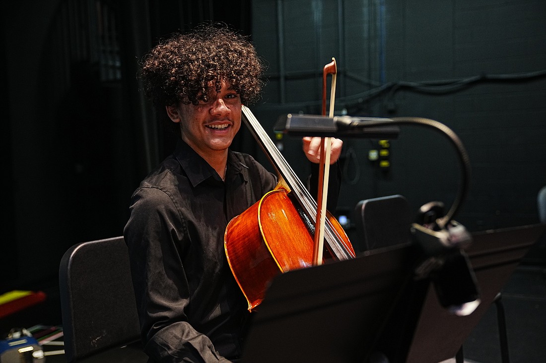 Cellist Corey Lehnertz and other Flagler Youth Orchestra members performed with an ELO tribute band at the Flagler Auditorium on June 25. File photo by Danny Broadhurst