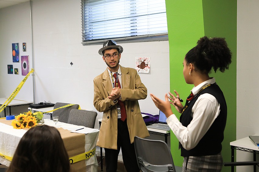 Diego Morales and Hannah Silva work through their lines behind the scenes.
