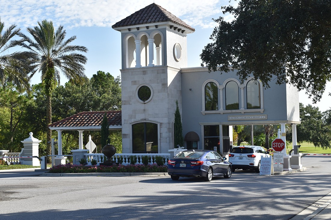 Drivers enter through the gatehouse at Country Club, on Legacy Boulevard. (Photo by Ian Swaby)