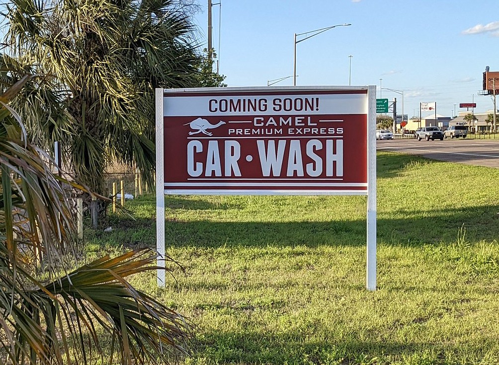 The sign for a future Camel Premium Express Car Wash northwest Atlantic and Southside boulevards.