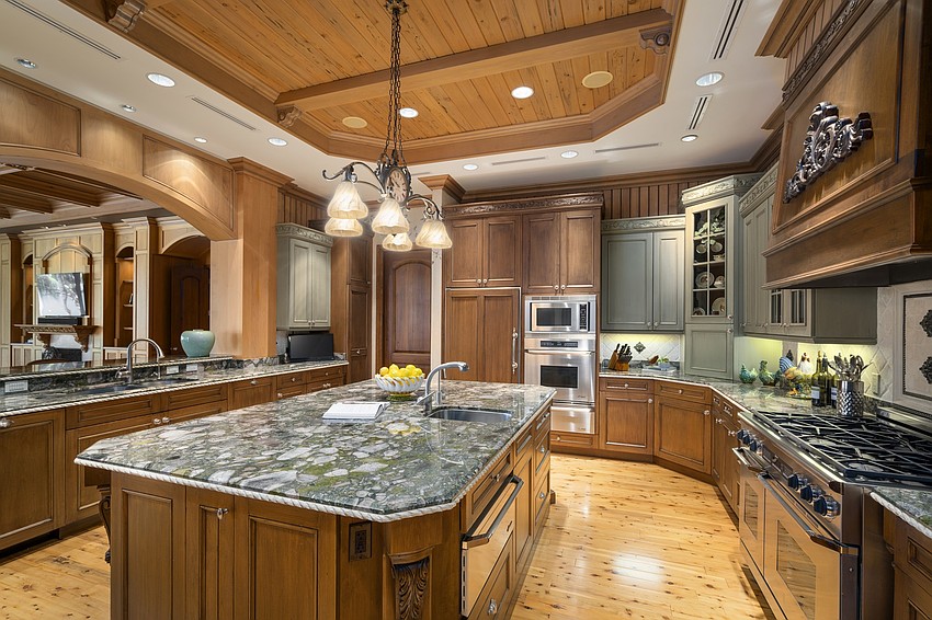 Crown moldings and wood carvings are featured throughout the home.