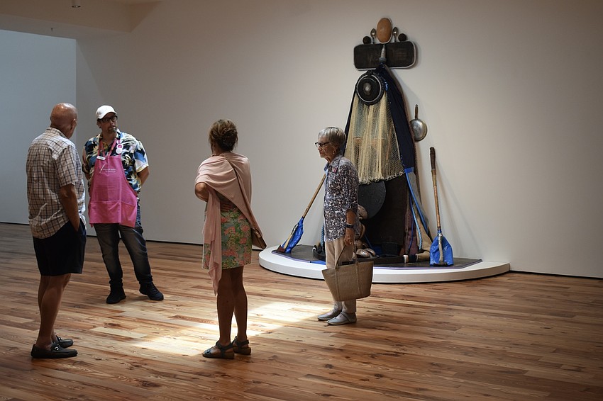 Docents greet visitors at each exhibit.