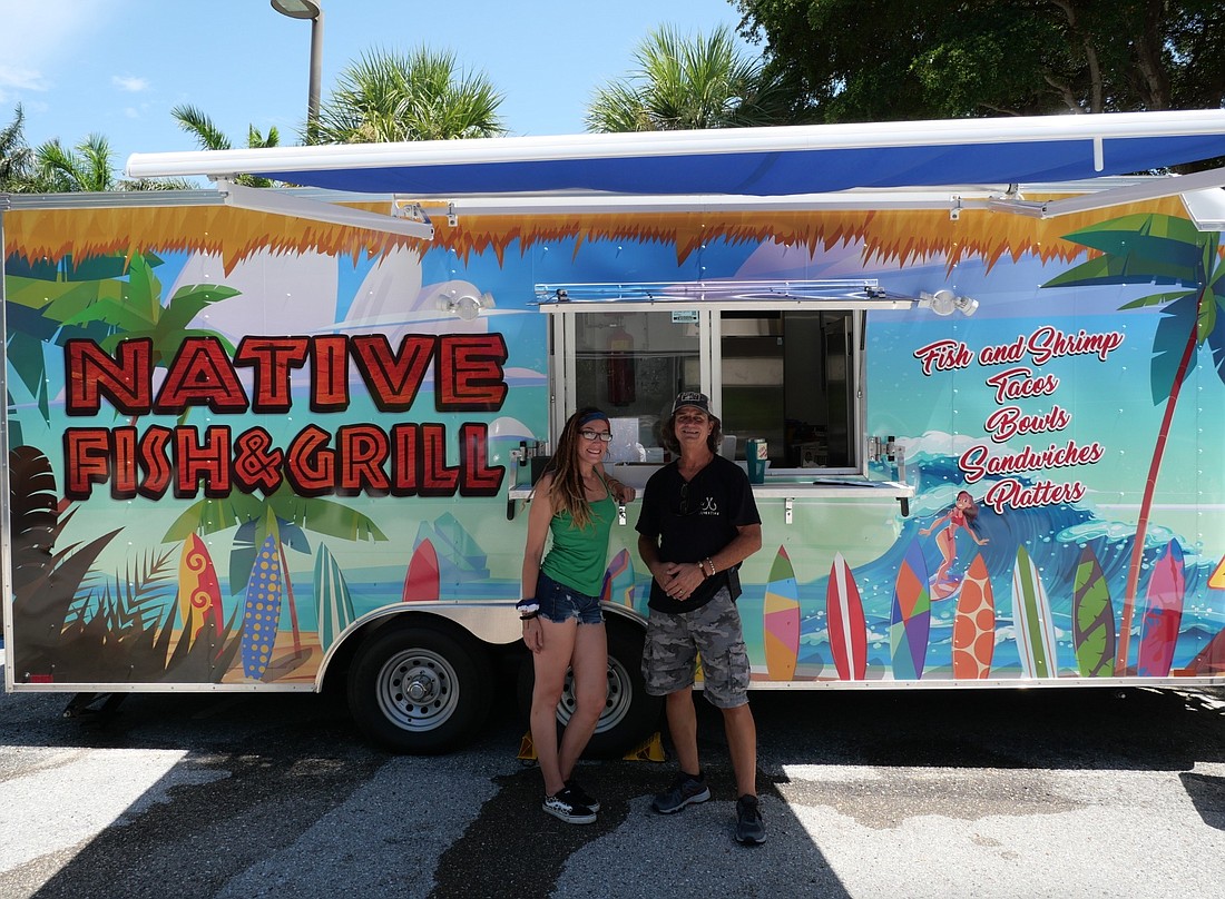 Autumn McMillan and Chris Skinner stand in front of their new food truck after serving to town public safety personnel. (Courtesy Photo)