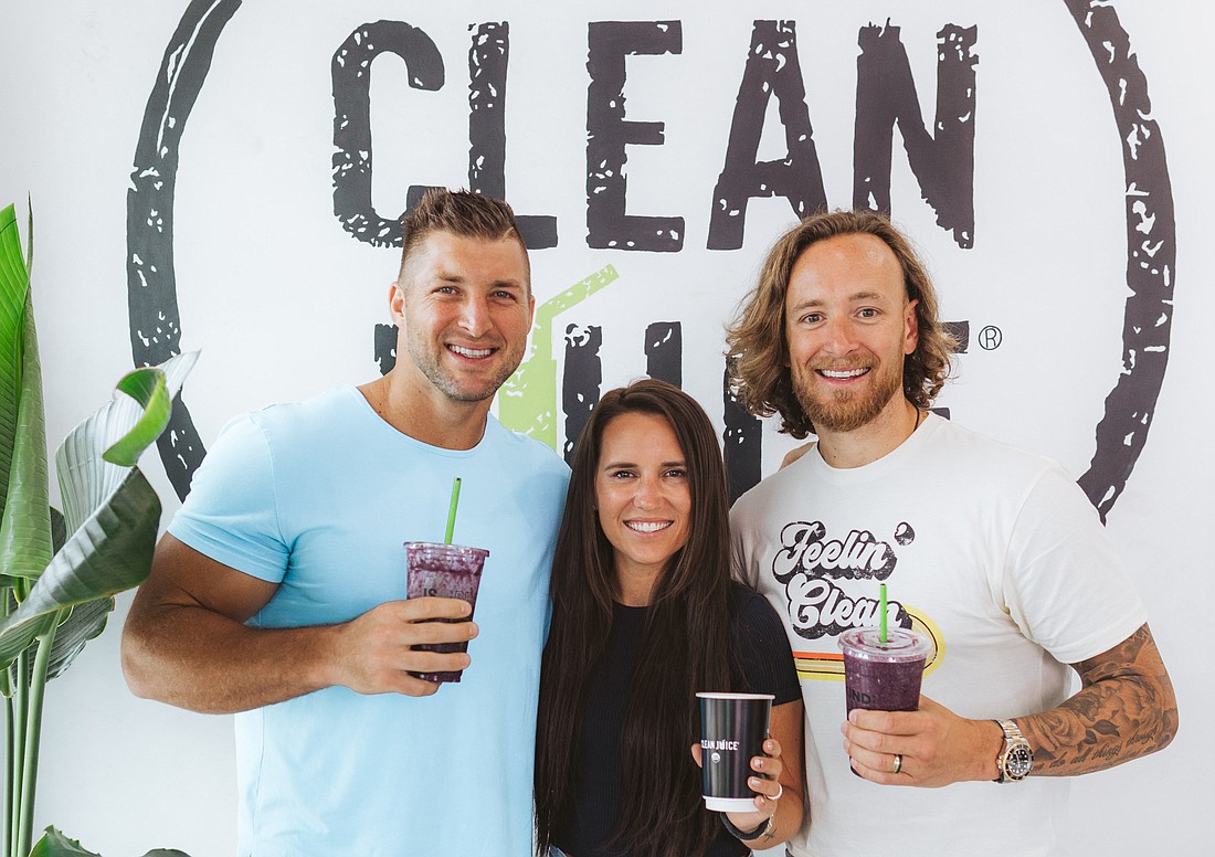 Special to the Daily Record: Former University of Florida and NFL quarterback Tim Tebow, left, with Kat and Landon Eckles, founders of Clean Juice.