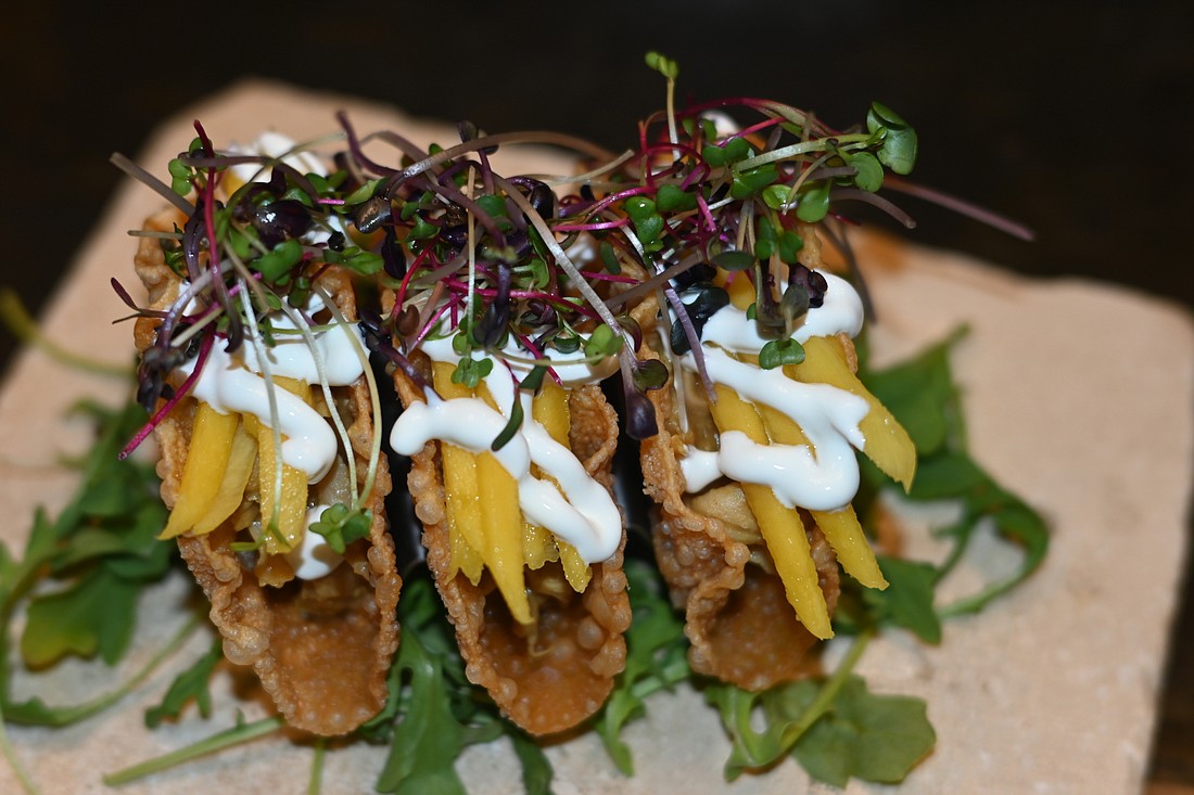 There&#39;s an element of the familiar and the exotic in the braised rabbit tacos at Melange. (Photo by Spencer Fordin)