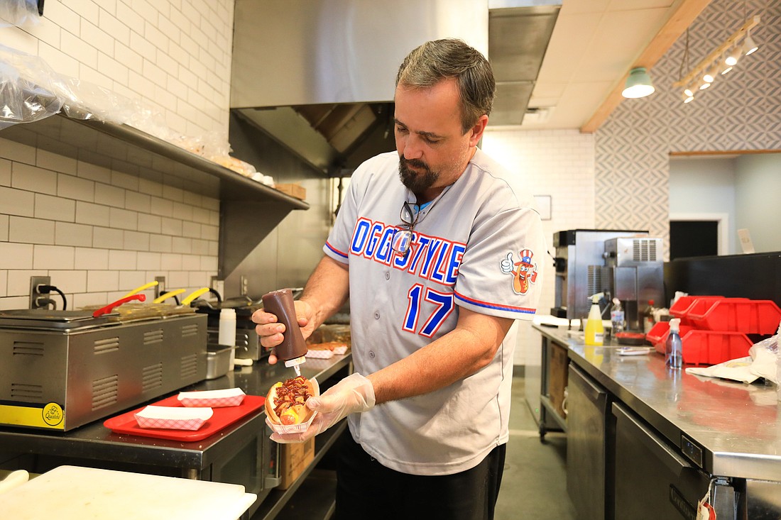 Steve DiBio has been accumulating hot dog recipes for years. (Photo by Harry Sayer)