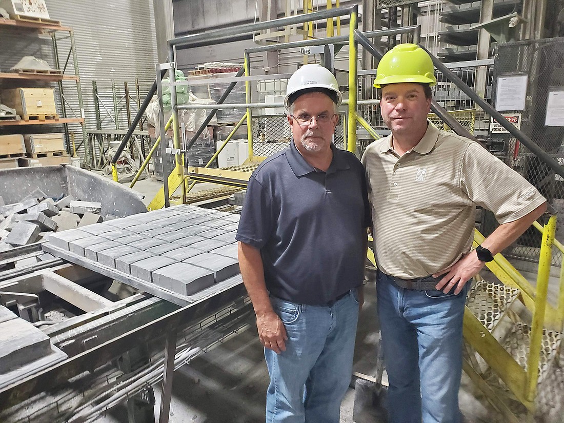 Jim Boedeker, left, is the director of sales for the Tremron paver manufacturing plant in Jacksonville. Patrick Lenow is the communications manager for Tremronâ€™s parent company, Quikrete.