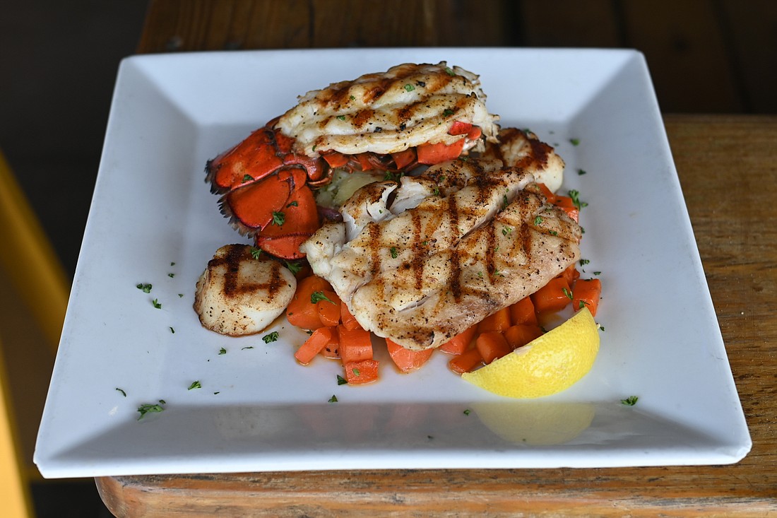 The Captain&#39;s Platter, which consists of lobster tail, snapper and scallops, is one of Walt&#39;s Fish Market&#39;s most popular dishes.  (Photo by Spencer Fordin)