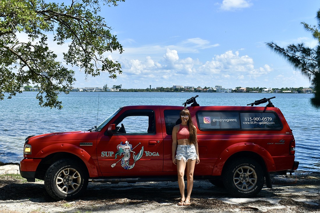 Steph Ouellette owns and operates SUP Yoga SRQ. (Photo by Lesley Dwyer)