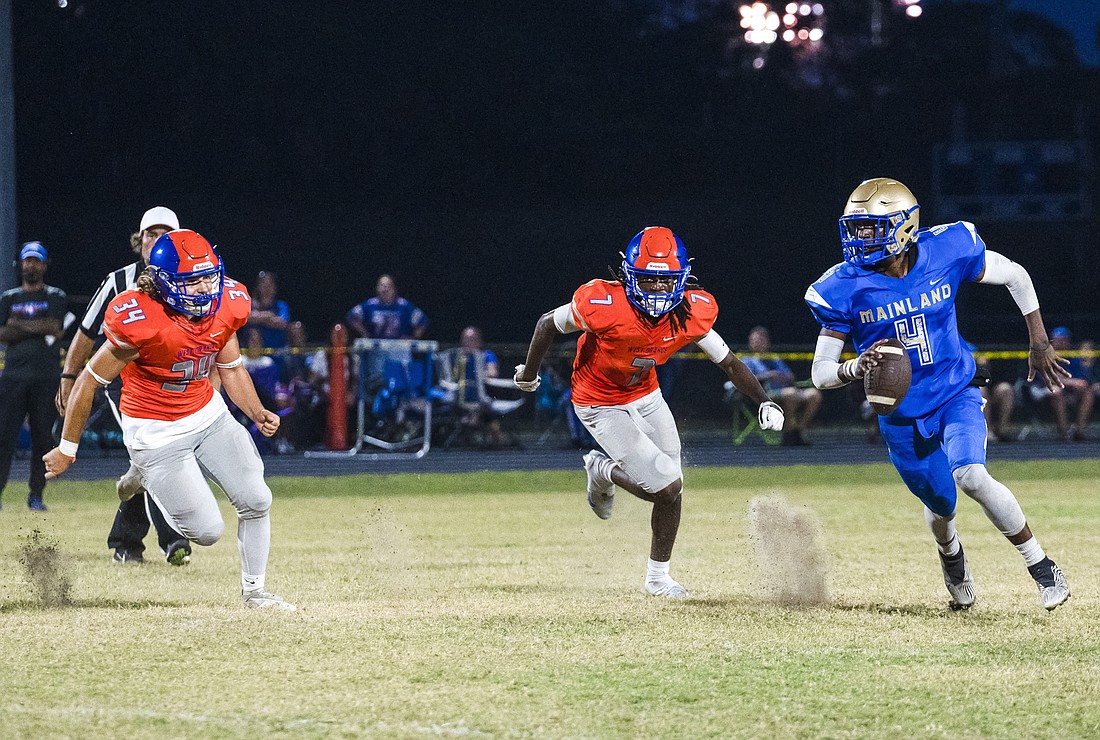 Mainland quarterback Damarcus Creecy (4), shown here playing in the spring jamboree game, passed for 301 yards and four touchdowns against DeLand on Aug. 26. File photo by Michele Meyers.
