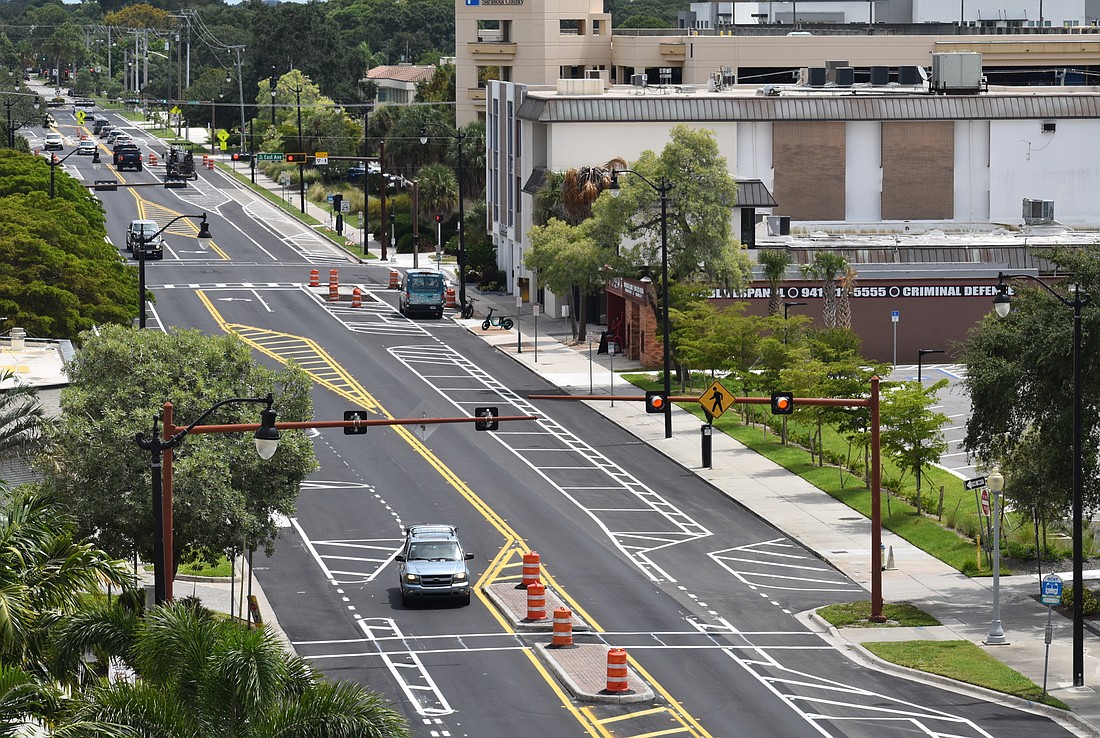 Work began in early June on the Ringling Trail project, which will convert one lane of traffic in each direction between Lime and Pineapple avenues into a protected bicycle lane. (Eric Garwood)