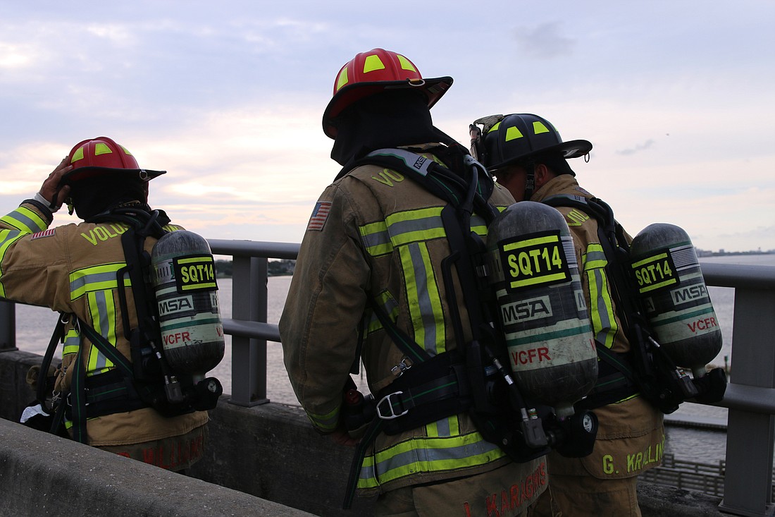 Firefighters make their way across the Granada Bridge during last year's 9/11 memorial walk. File photo