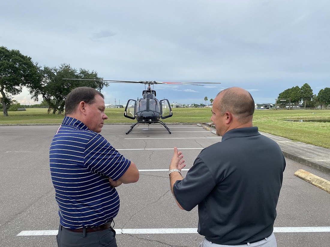 Rep. Sam Graves and Commissioner Kevin Van Ostenbridge converse before their flight. (Courtesy photo)