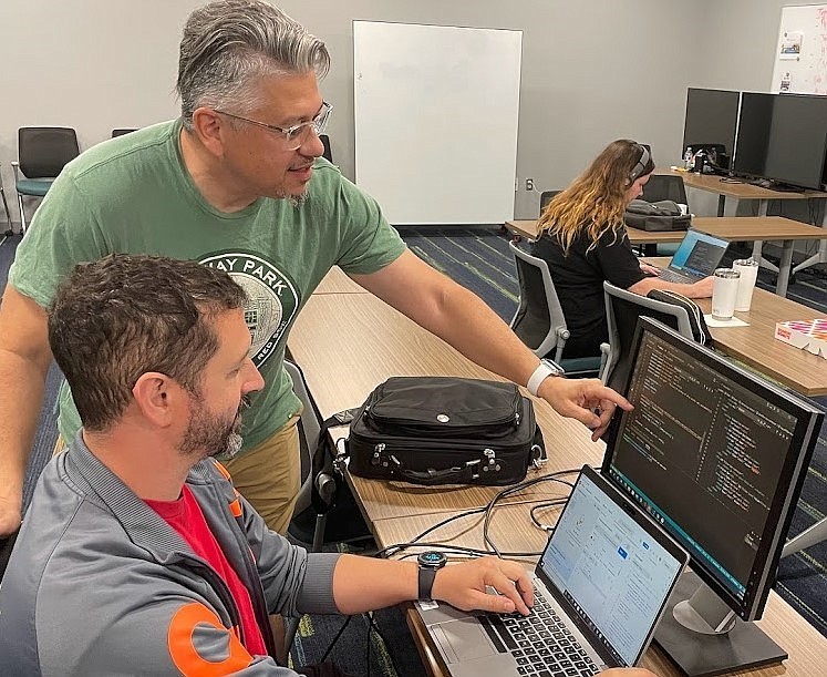 Pictured are coding academy students Benjamin Howe, Johnny Ortiz and Emily DeHaan. (Photo courtesy of State College of Florida Manatee-Sarasota)