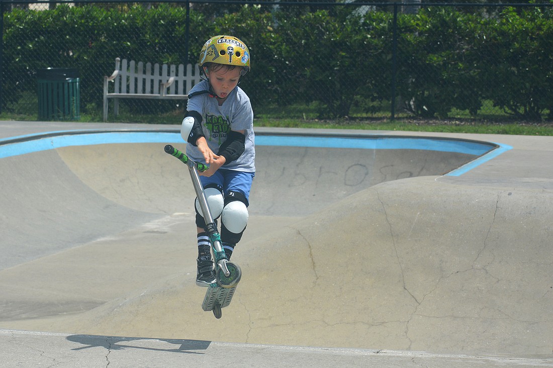 Kai Haines, 6, shows why he&#39;s called "Krazy Kai" as he completes a bar spin at Payne Park. (Photo by Ryan Kohn.)