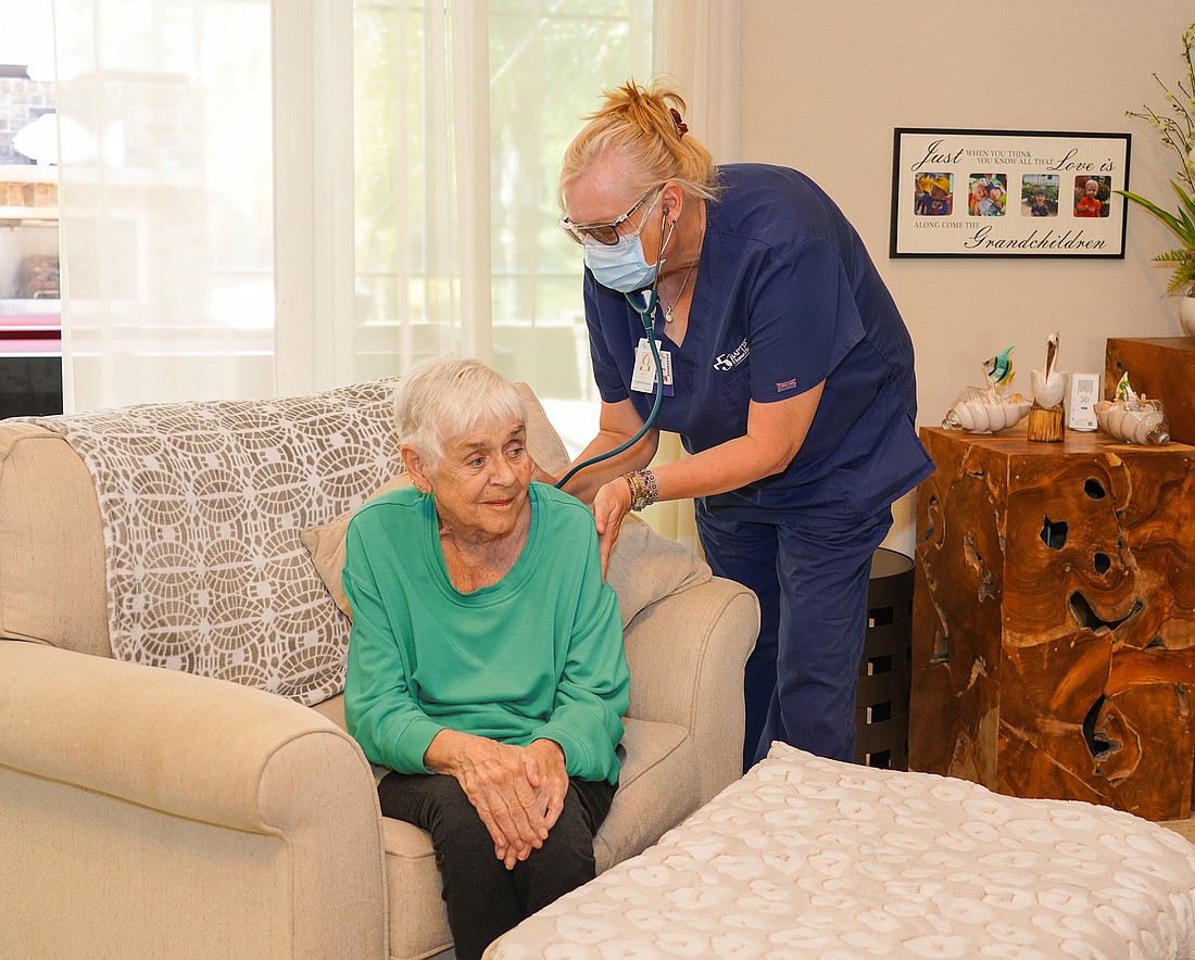 Baptist Home Care registered nurse Janet Jones checks wound care patient Mary Croninâ€™s vital signs during a home visit in March.