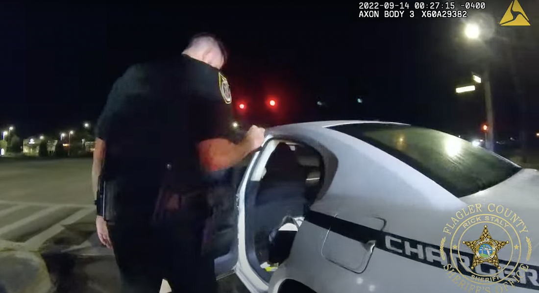 A deputy searches the car. Photo from FCSO body camera footage