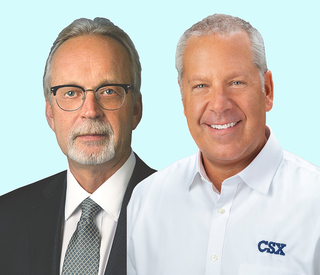 Retiring CSX Corp. CEO Jim Foote and Joseph Hinrichs, a former executive with Ford Motor Co.