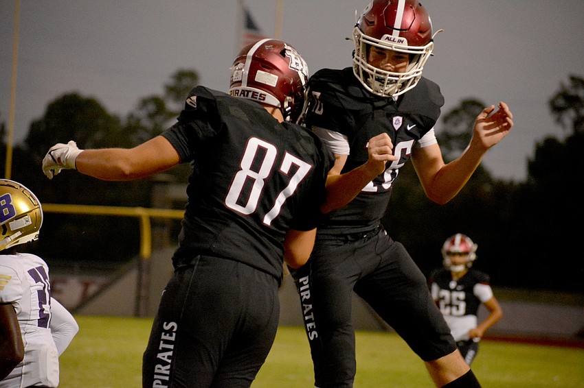 Braden River tight end Cody Kawcak (87) and quarterback Lucas Despot celebrate after combining on a touchdown pass against Booker High in 2022.