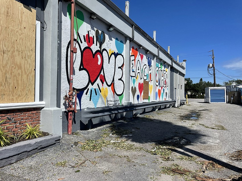 In the wake of Hurricane Ian, an apt message on a downtown Siesta Key mural by Brandon Thrift remained undamaged.