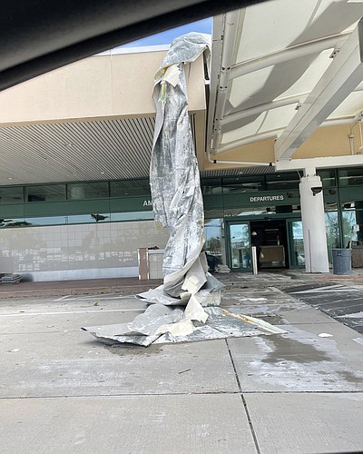Water didnâ€™t pour into the terminal. The membrane covers other roofing materials, but eight hours of leeching rainwater caused plenty of damage.   (Photo by Ryan Kohn)