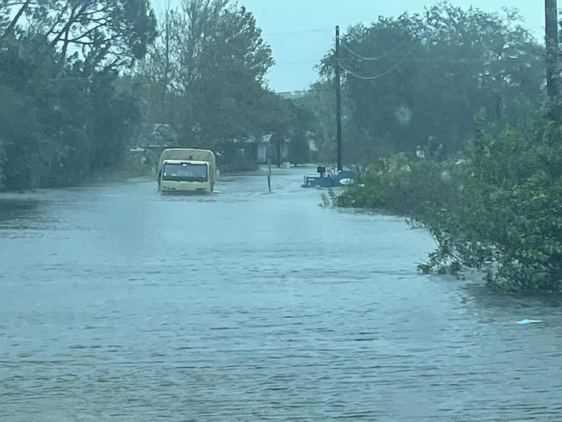 A Volusia Sheriff's Office high-water rescue vehicle drives a flooded street. Photo courtesy of the VSO