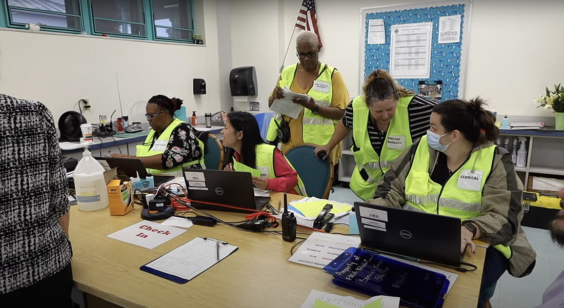 A school hurricane shelter check-in station. Image from Volusia County Schools video