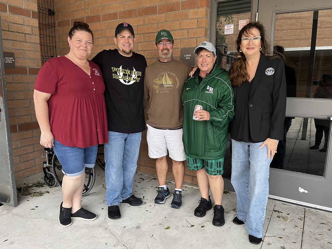 Braden River High&#39;s Rebecca Austerman, Prine Elementary&#39;s Scott Flynn, Lakewood Ranch High&#39;s Mike Staker and Jeannie Galindo and Superintendent Cynthia Saunders care for evacuees at Braden River High School. (Photo by Liz Ramos)