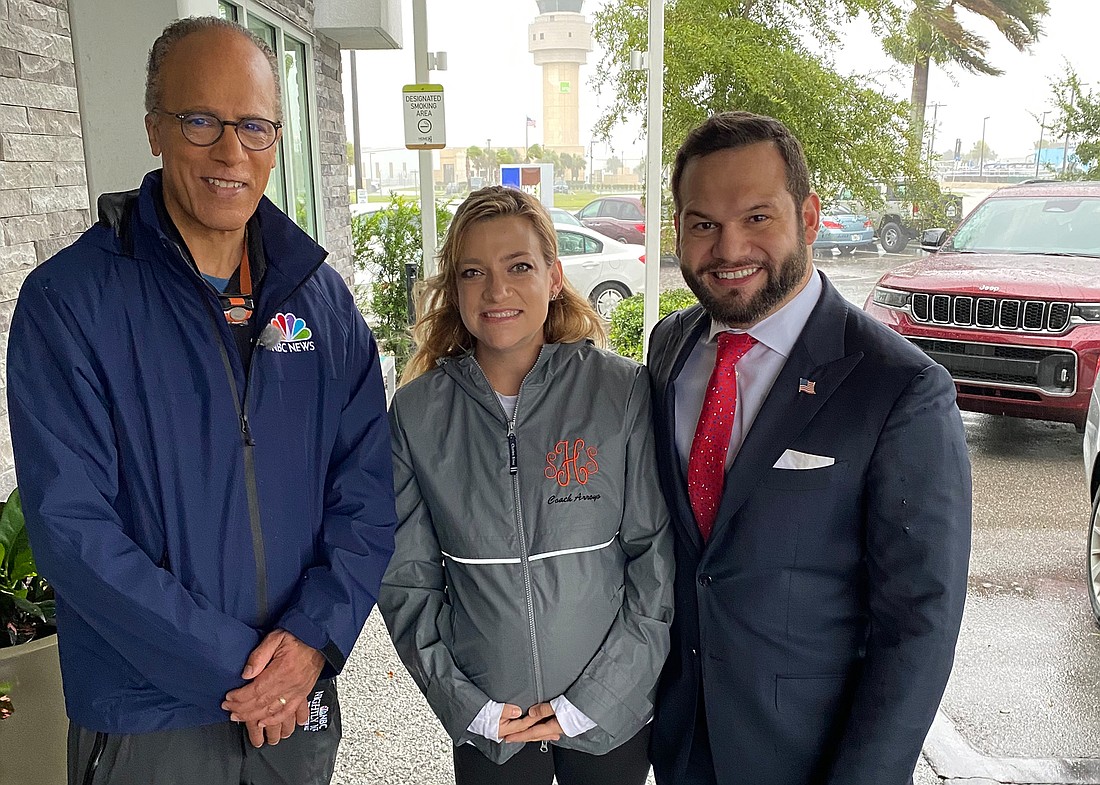 NBC News Anchor Lester Holt (left) came to Sarasota to interview Mayor Eric Arroyo during final preparations for Hurricane Ian. They are pictured here with Arroyo&#39;s wife, Victoria. (Courtesy photo)