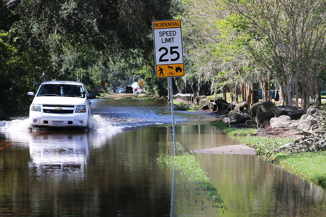 A truck drives through floodwaters at Fleming Avenue on Friday, Sept. 30, 2022. Photo by Jarleene Almenas