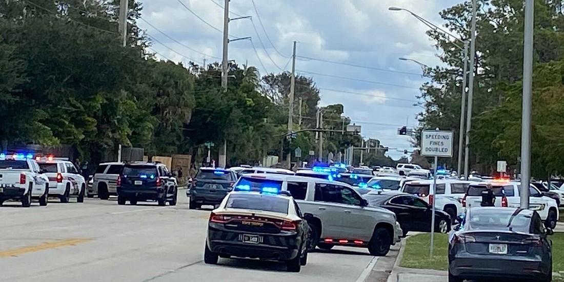 Law enforcement personnel from at least four agencies are blocking traffic near Riverview High School. (Lauren Tronstad)