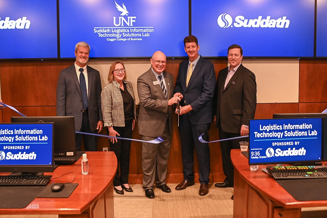 David Swanson and Dawn Russell of the UNF Transportation and Logistics Program faculty; Richard Buttimer, Coggin College of Business dean; Suddath Companies CEO Michael Brannigan; and Len Oâ€™Neill, Suddath senior vice president.