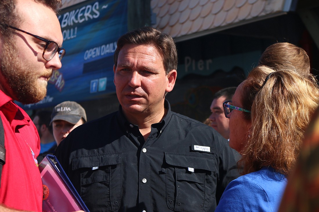 Gov. Ron DeSantis spoke to several of his constituents after taking a look at the damaged Flagler Beach pier. Photo by Sierra Williams