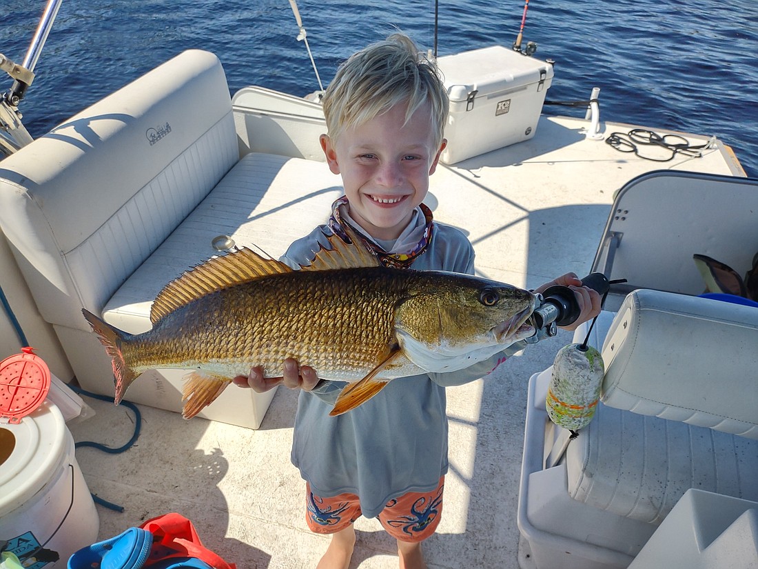 Scotty Jr. Cornelius holds up a fish he caught during the tournament. Courtesy photo
