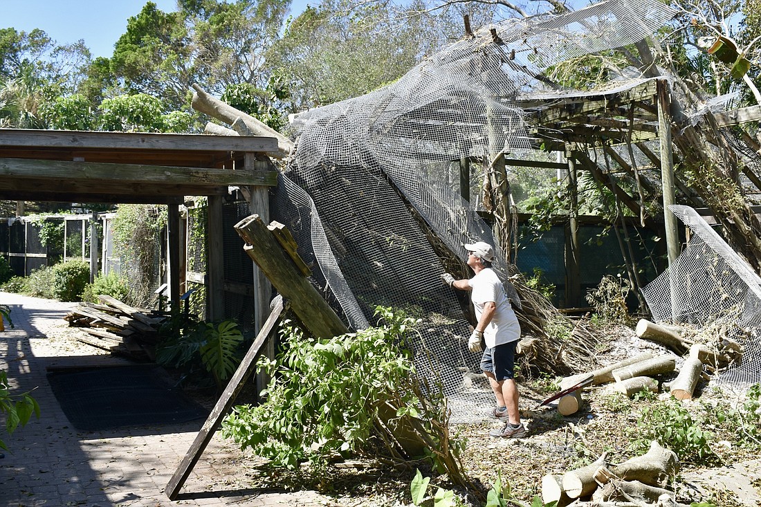 The CEO&#39;s dad Dennis Virgin helps clean up the facility following Hurricane Ian. (Lesley Dwyer)
