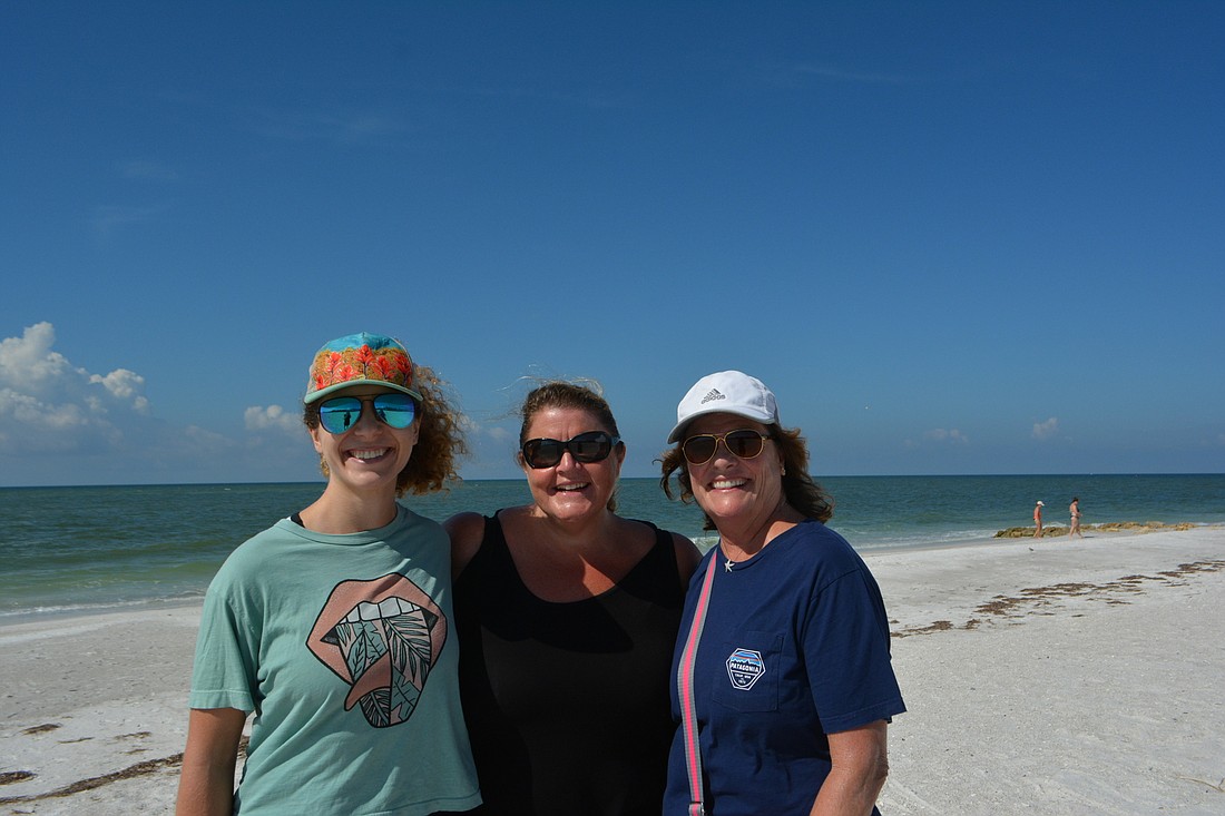 Sarah Cirone, left, Annie Glennon and Kathleen Eidson tout privacy of the Key&#39;s beaches. (Photo by Lauren Tronstad)