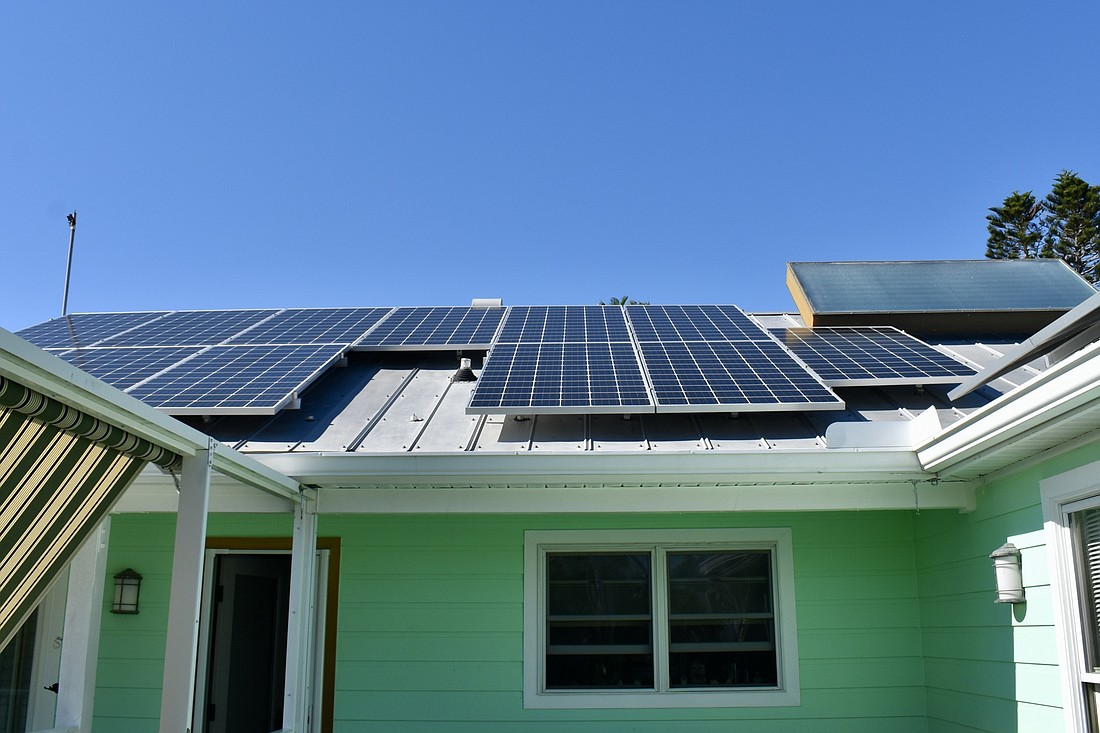 Solar panels in 2019 on the roof of Longboat Key residents Rusty Chinnis and Chris Killeen's house. Rooftop solar panels are a relatively rare sight on Longboat Key.